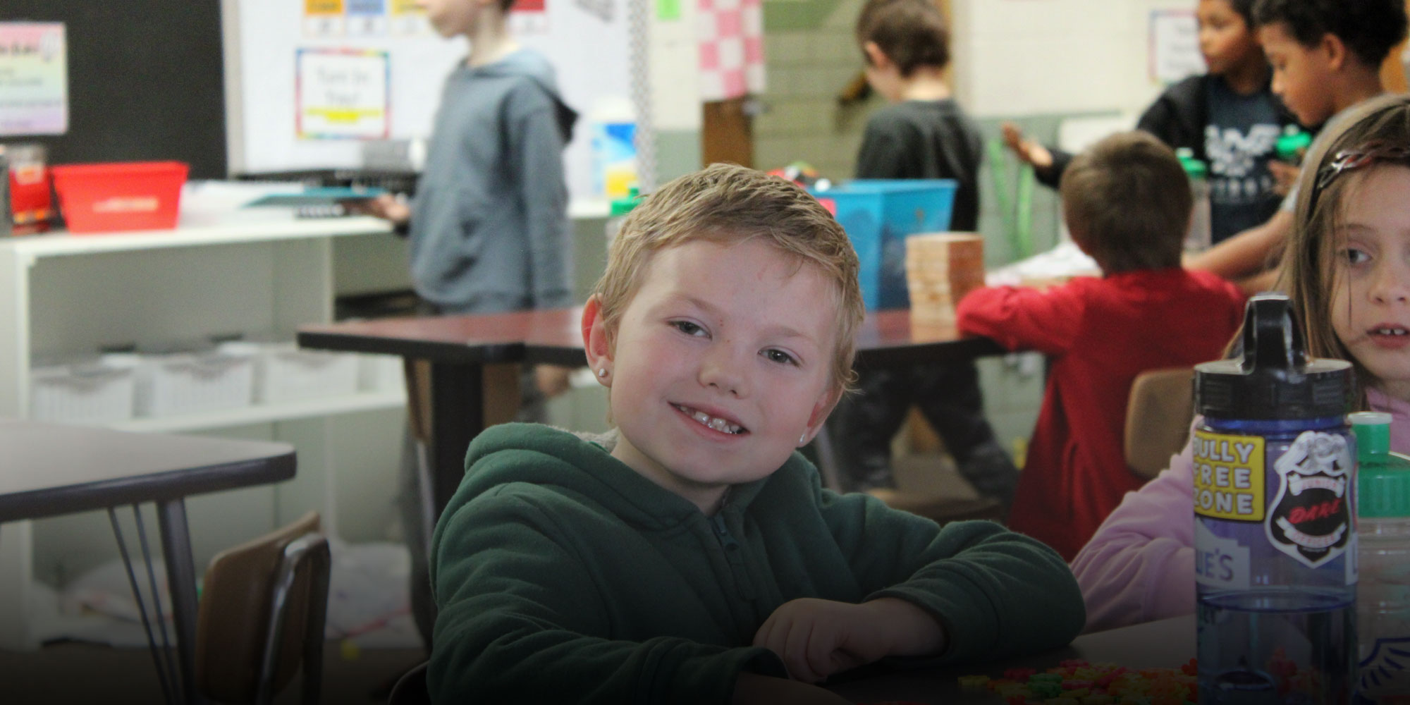 elementary student learning with blocks