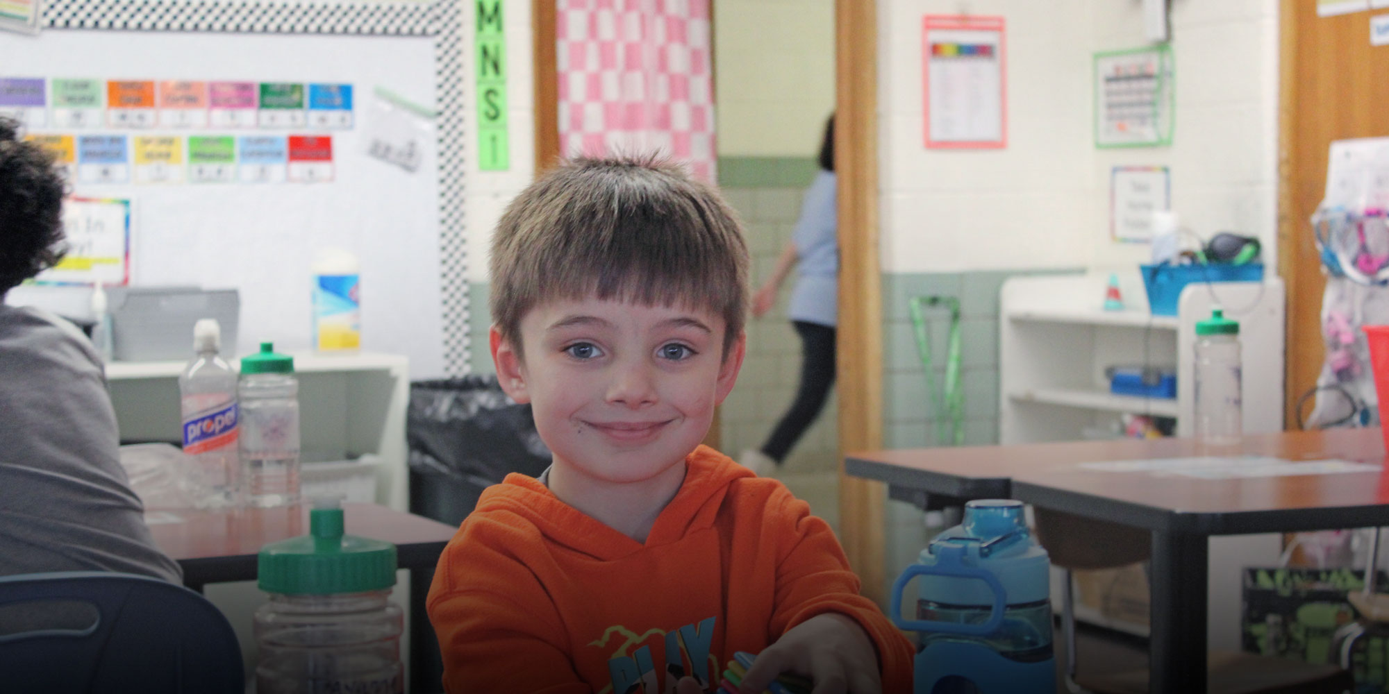 elementary student learning with blocks